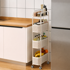 A white four-tier rolling kitchen organizer cart with woven baskets, shown in a kitchen next to a wooden countertop and refrigerator.