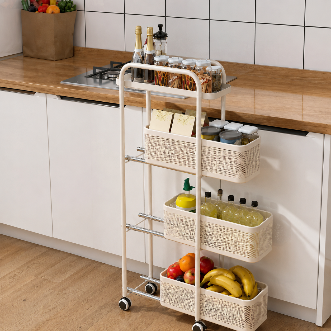 A three-tier rolling kitchen organizer cart with woven cream baskets, shown in a modern kitchen next to a wooden countertop and white cabinets.